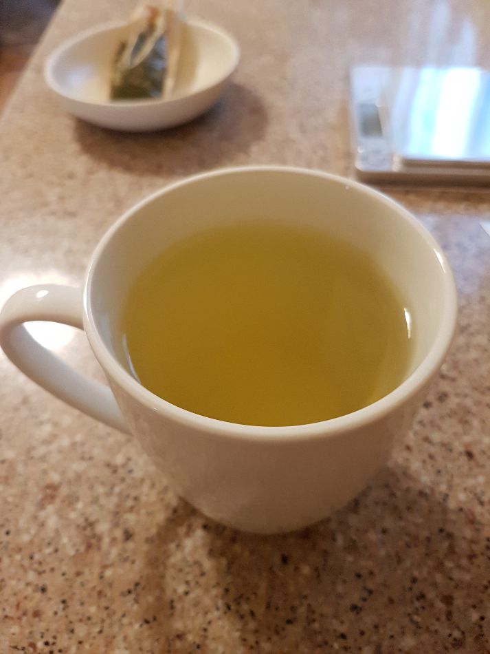 A hot, freshly brewed mug of yuzu green tea.