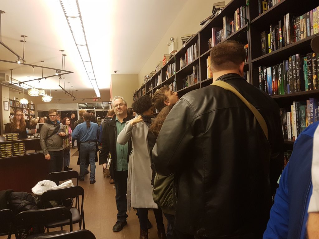 People at the book launch waiting in line to get their copies of Persepolis Rising signed.