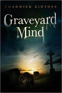 The cover of Graveyard Mind, by Chadwick Ginther, shows a graveyard and tombstones silhouetted by a cloudy horizon.