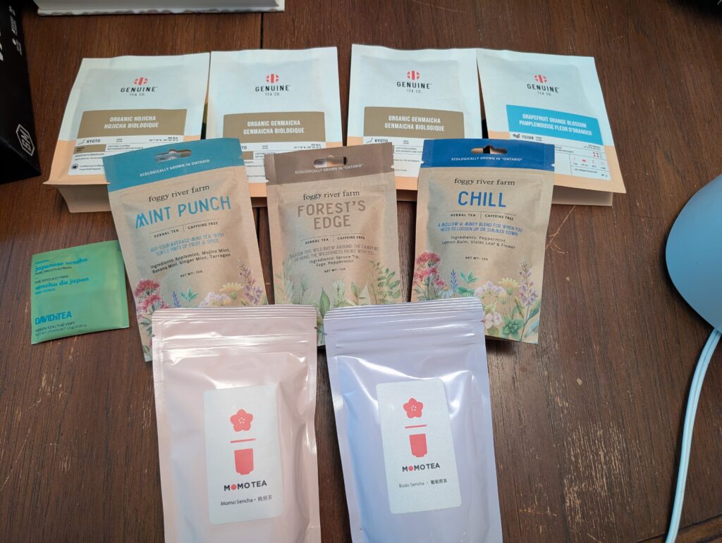 My haul from the 2026 Toronto Tea Festival, showing teas from Foggy River Farm, Genuine Tea and Momo Tea.